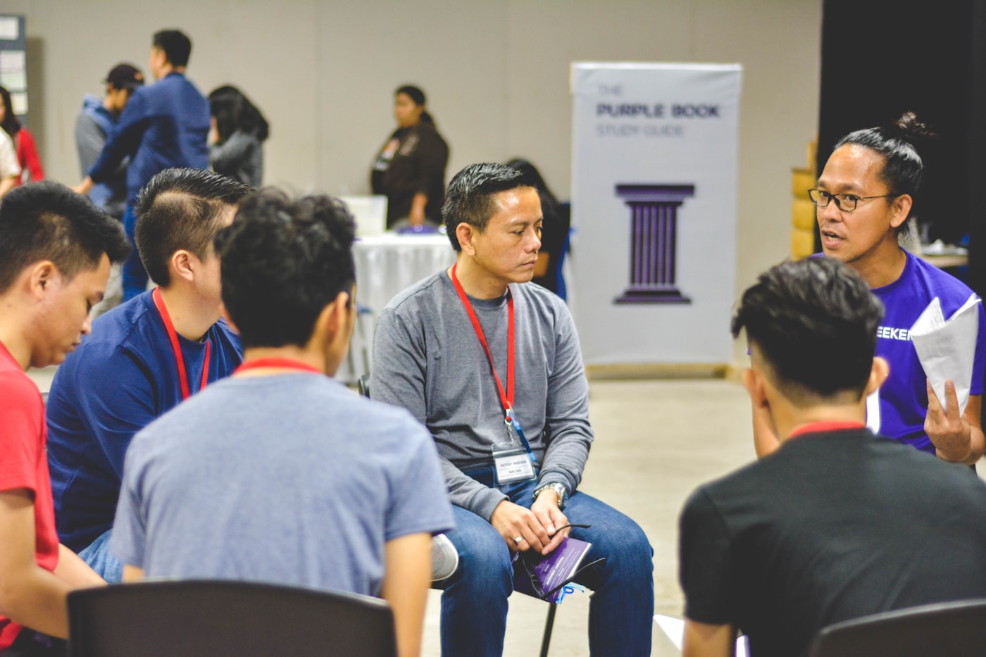 A group having an open conversation together in a circle