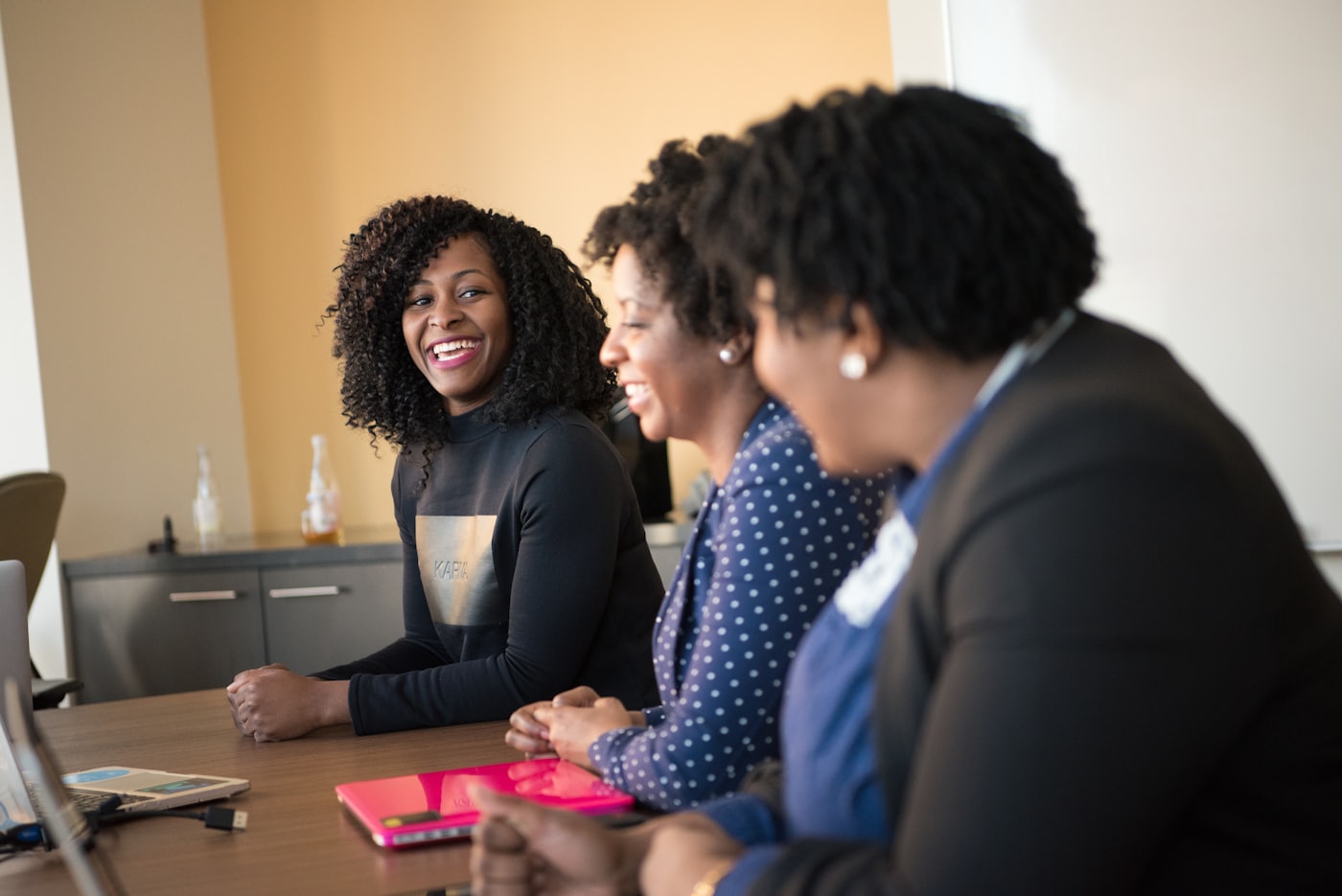 Colleagues planning together at a wooden table